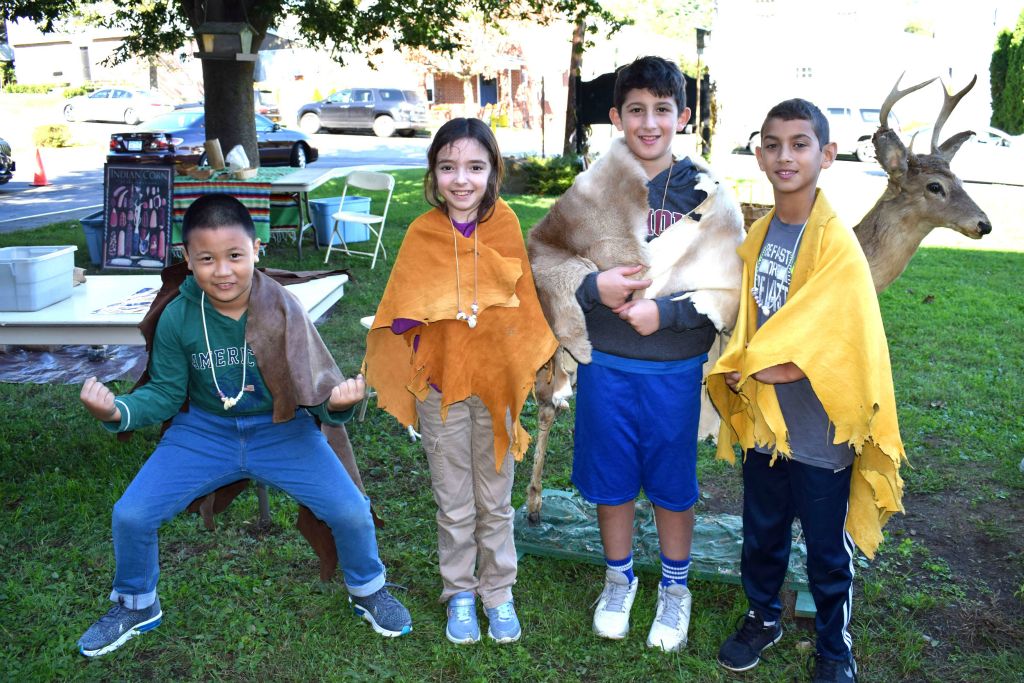 students wearing animal skins 